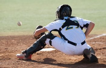 a baseball catcher catching a ball