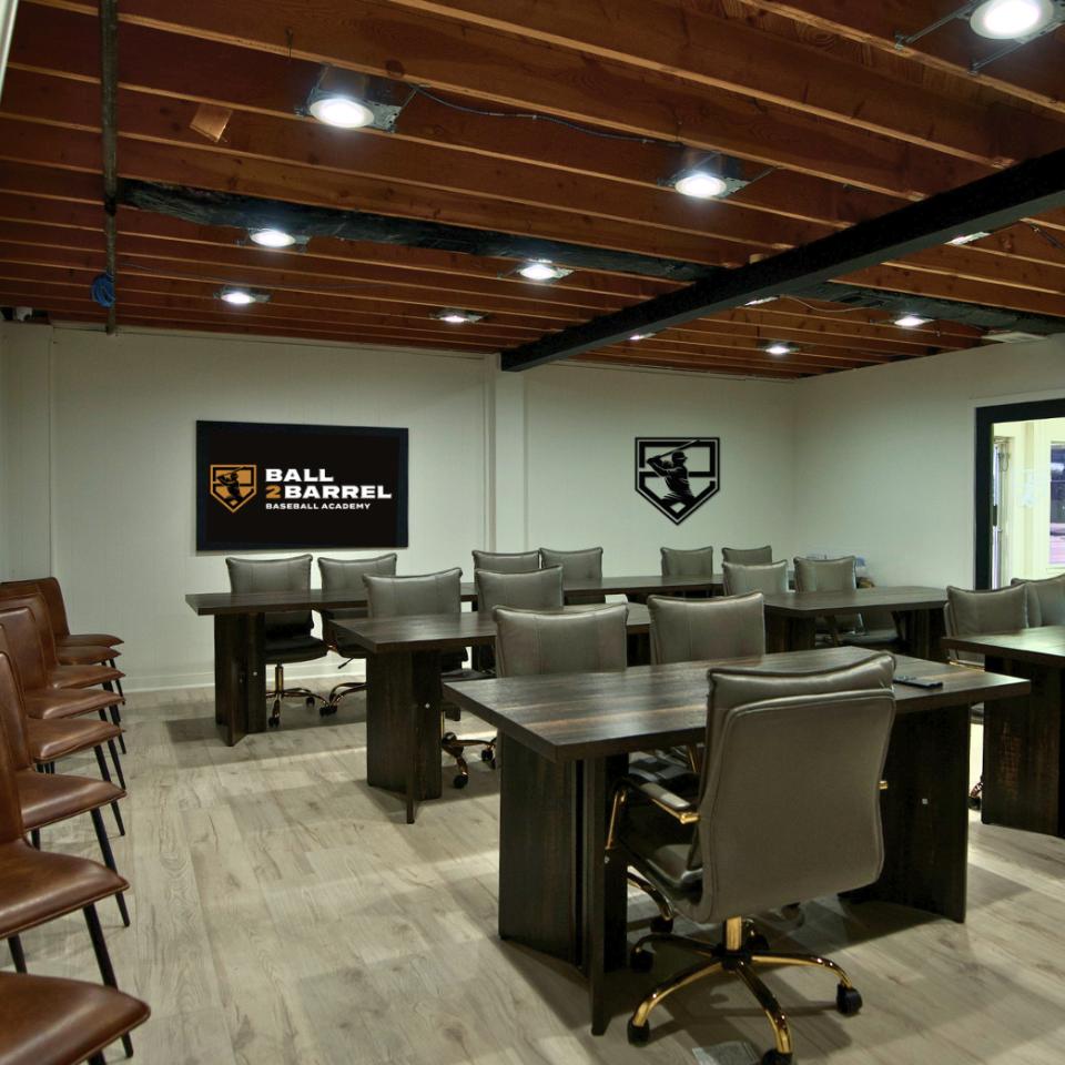 Team conference room at Ball 2 Barrel Baseball Academy used for strategy sessions, video review, and team development meetings.